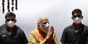 Indian Prime Minister Narendra Modi,centre,arrives for the groundbreaking ceremony of a temple dedicated to the Hindu god Ram,in Ayodhya.