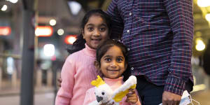 Australian-born Tharnicaa and Kopika Murugappan at Perth Airport on their way home to Biloela in June. The family have been granted permanent visas.