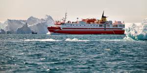One of Arctic Umiaq’s coastal ferries among icebergs in Greenland’s Ilulissat Icefjord.