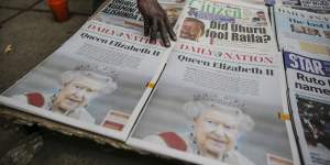 Kenyan newspapers show coverage of the death of Queen Elizabeth II at a stand in downtown Nairobi.