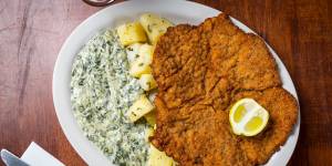 The infamous wiener schnitzel served with potatoes and creamed spinach.