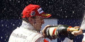 Lewis Hamilton finished third in Melbourne in 2007 and celebrates on the podium with Fernando Alonso.