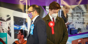 Conservative Party candidate Neil Shastri-Hurst (left) and Ben Wood,of the Labour Party,listen to North Shropshire by-election winner Helen Morgan of the Liberal Democrats,make her acceptance speech on Friday.