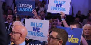 Members of the Conservative Party hold signs supporting Liz Truss for PM,during a leadership hustings in Norwich on August 25.