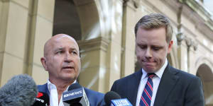 Nick Andrianakis and Michael Donelly speak outside the Supreme Court of Victoria on Monday.