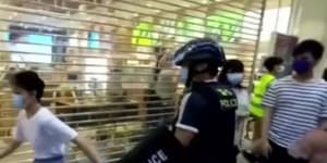 Outcry after Hong Kong riot police tackle 12-year-old to the ground