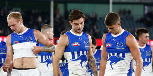 North Melbourne skipper Jy Simpkin (centre) hasn’t been at as many centre bounces as last year.