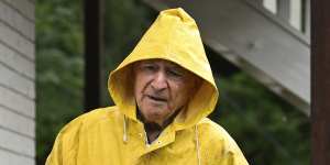 82 year-old Russell Willis sandbags his house in Graceville,a Brisbane suburb prone to flooding,on Thursday.