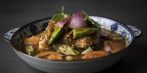 Assam nonya curry with toothfish,a sweet-and-sour dish studded with okra,tomato and red onion.