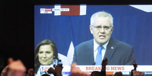 Labor supporters cheer as Scott Morrison concedes defeat in the May federal election.