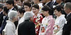 Japanese Olympian Ai Fukuhara (second from right) speaks with Emperor Akihito and Empress Michiko in Tokyo in 2017.
