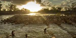 Kids swimming in the fishway at Brewarrina Weir,north-west NSW in February when the first strong flows in years came down the dry Barwon River in the Murray Darling Basin. 