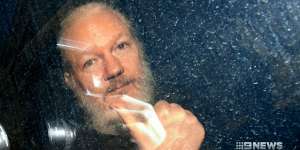 Julian Assange is driven away from the Ecuadorian embassy in London after his arrest.
