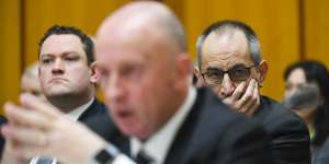 Mike Pezzullo,right,called Australian Federal Police's Deputy Commissioner Neil Gaughan,centre,after a raid on a News Corp journalist's house.