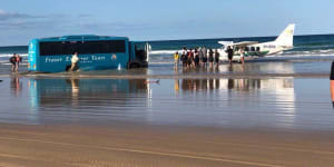 Tour bus bogged on Fraser Island beach after failed plane rescue attempt