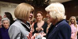 Queen Camilla greets Vogue editor-in-chief Anna Wintour at New York Public Library.