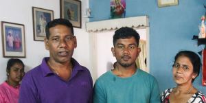 Warnakulasuriya Julian Priyanshan Fernando (centre) with his parents Emmanuel Anandan Fernando and Warnakulasuriya Mallika Rojini Fernando at their home in Negombo.