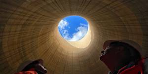The ultimate echo chamber:Greenspot chief executive Brett Hawkins (left) and part owner Neil Schembri look skyward from inside the cooling tower of the shuttered Wallerawang Power Station. 