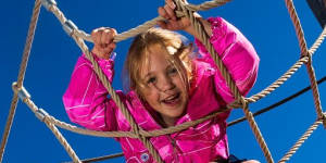 Anna,6,hangs around at the playground. 