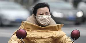 A woman wears a mask in Wuhan,which has been linked to cases of the new coronavirus.