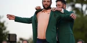 Scottie Scheffler receives the green jacket at Augusta in April.