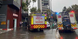 At least three people are trapped in a lift at East Village shopping centre after a power outage. 