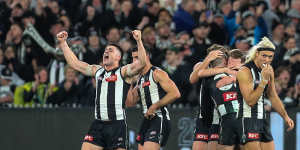 Jubilation:The Magpies after the final siren.