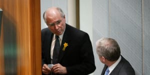 John Howard talks to then Labor leader Simon Crean in the House of Representatives in August 2003. Days later,Howard would convince his cabinet to dump support for an emissions trading scheme.