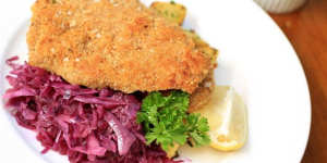 Veal schnitzel with braised cabbage.