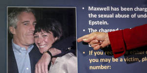 A US attorney points to a photo of millionaire Jeffrey Epstein and British socialite Ghislaine Maxwell during a news conference last year.