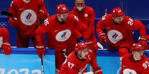 Team ROC skate onto the ice to celebrate its victory over Sweden in the men’s ice hockey semifinal at the Beijing Olympics on Friday.