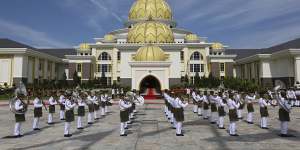 Military band perform during a welcoming ceremony of the 17th King of Malaysia.