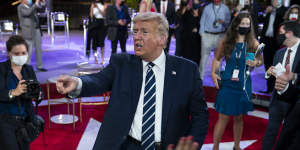 President Donald Trump talks with voters after his town hall in Miami.