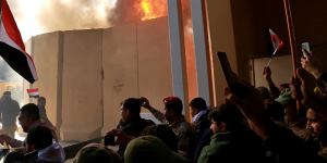 Protesters break into the US embassy compound,in Baghdad,Iraq,on Tuesday.