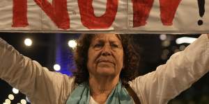 People demonstrate outside the Kyria defence complex in Tel Aviv as Israel’s cabinet meets.