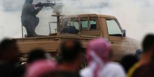 An Emirati soldier fires blanks in Abu Dhabi,UAE,earlier this month during a major military exercise as the nation fights alongside Saudi troops in Yemen.