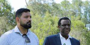 Family spokesman Ali Kadri with Raghe Abdi’s father,Mohammad,at Calamvale District Park on Friday,December 18. 