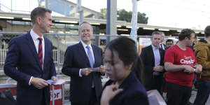 Labor candidate for Reid Sam Crosby and Opposition Leader Bill Shorten campaigning at Rhodes train station.