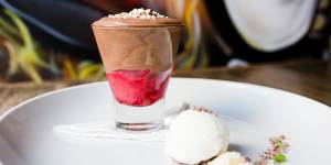 The chocolate mousse is sweet and light with a layer of raspberry at the base.
