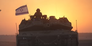 Israeli tanks head towards the Gaza Strip border in southern Israel.