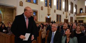  Peter Dutton alongside Prime Minister Scott Morrison and wife Jenny during a Parliamentary church service at the St Christopher’s Catholic Cathedral in Manuka,in Canberra in 2019. 