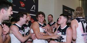 Charlie Curnow is the centre of attention as the Blues celebrate a rare win at the Adelaide Oval.