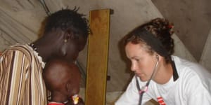Anna Kent examining a child in 2007 at the Therapeutic Feeding Centre in Leer,in what is now known as South Sudan.