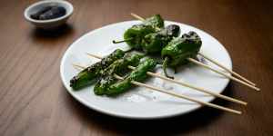 Shishito and padron peppers on skewers:beware the occasional super-hot one.