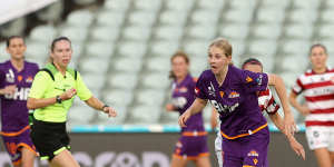 Hana Lowry of Perth Glory on the run against Western Sydney Wanderers on Sunday.