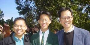 Eddie Woo,centre,flanked by his brother and father,in his James Ruse days.