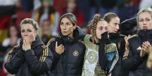German players react following their shock exit in Brisbane on Thursday night.