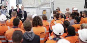 Then-opposition leader and former AWU boss Bill Shorten speaks with workers on the West Gate Tunnel during the 2019 election campaign.