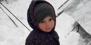 Fatema,2,the daughter of Mariam Dabboussy and granddaughter of activist Kamalle Dabboussy,in the snow at al-Hawl camp this week.