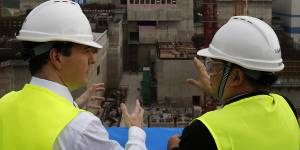A 2013 file photo of the George Osborne,then the UK’s Chancellor of the Exchequer,with Taishan Nuclear Power Joint Venture general manager Guo Liming,during the plant’s construction.
